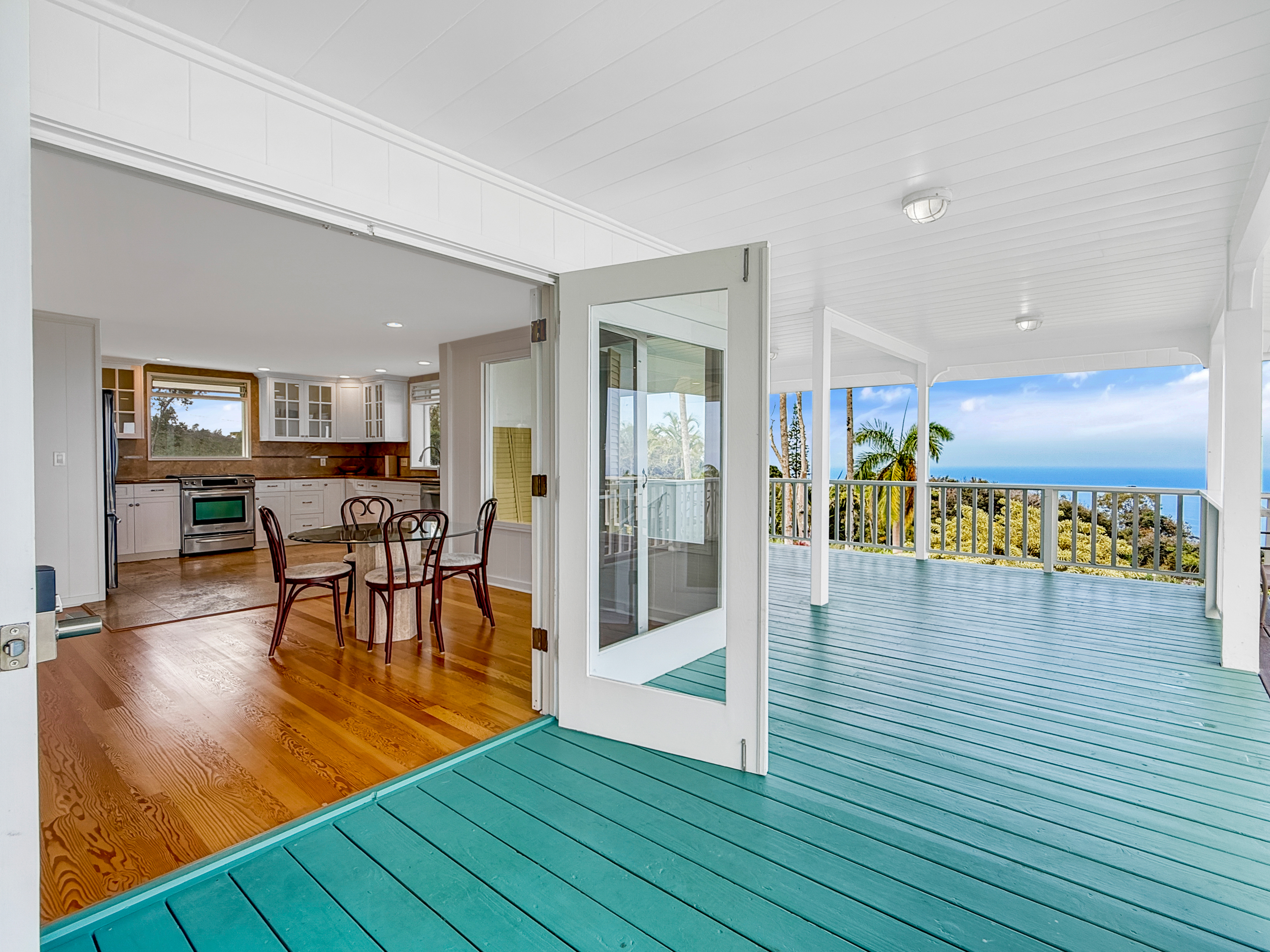 76-5807 Ho'okahi Road, Unit 1 Holualoa, HI 96725 - Photo 14 of 24 a view of a dining hall with wooden floor