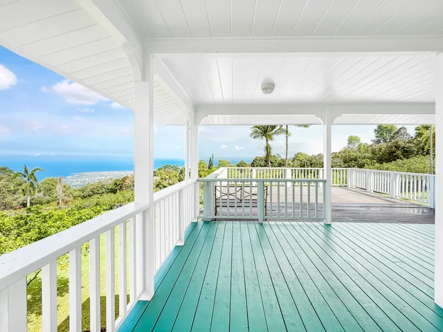a view of balcony with wooden floor