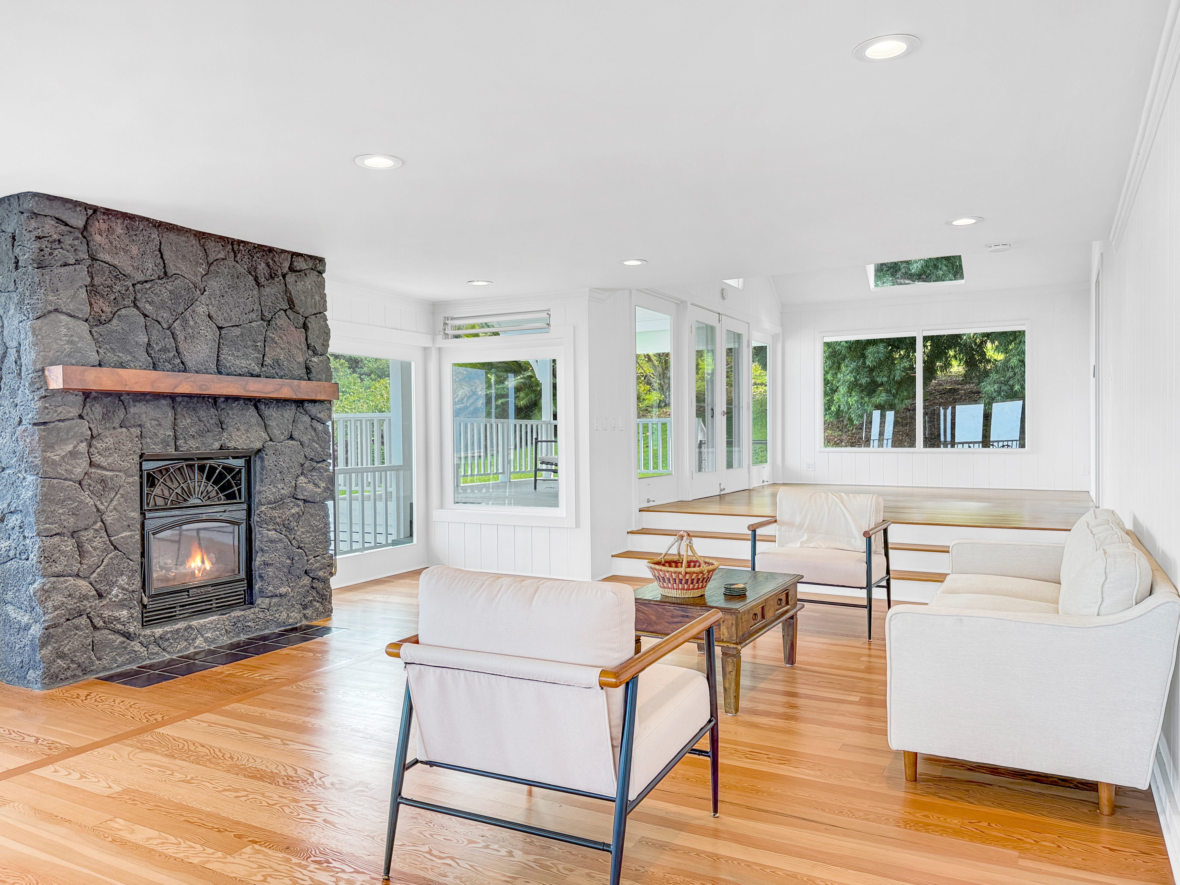 76-5807 Ho'okahi Road, Unit 1 Holualoa, HI 96725 - Photo 3 of 24 a living room with furniture and a fireplace