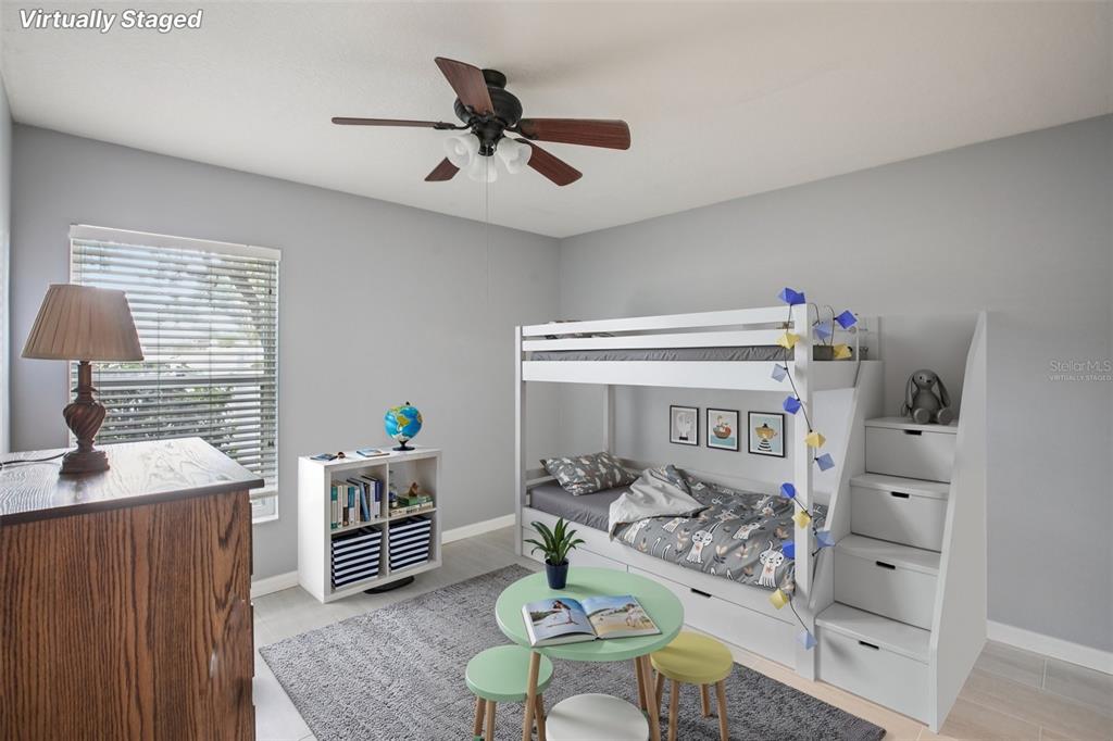 2903 Mossy Timber Trail Valrico, FL 33596 - Photo 19 of 39 a room with furniture a rug and a window