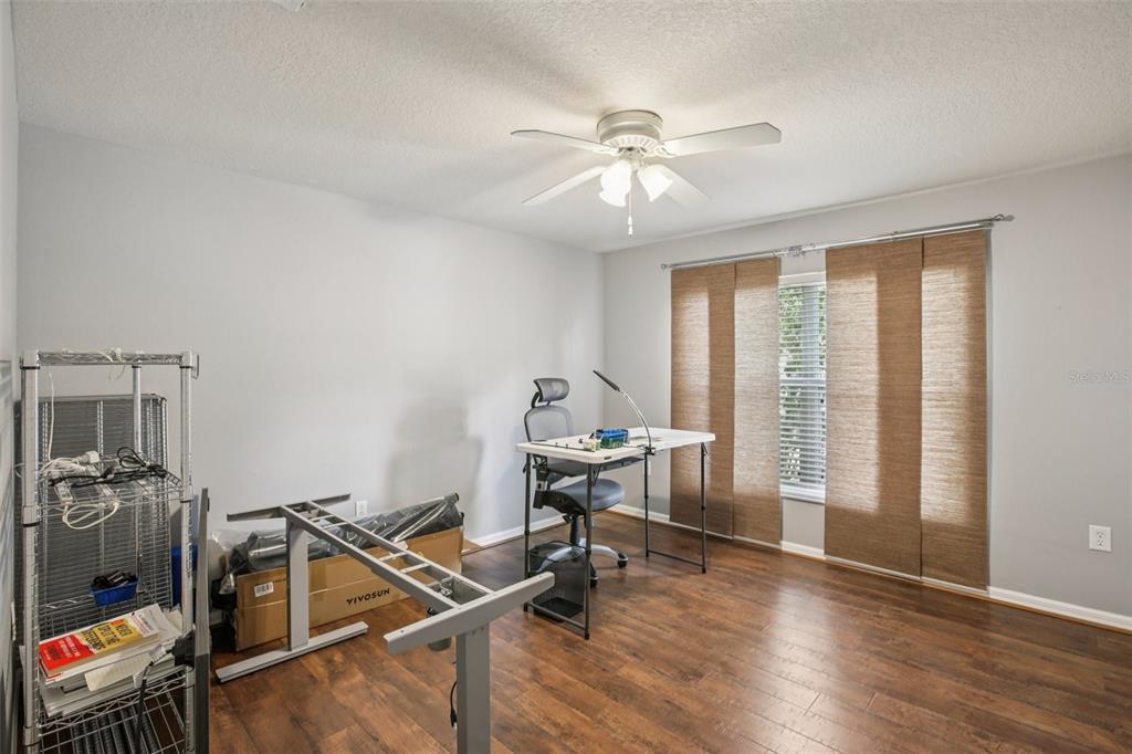 2903 Mossy Timber Trail Valrico, FL 33596 - Photo 24 of 39 a view of a workspace with furniture and a window