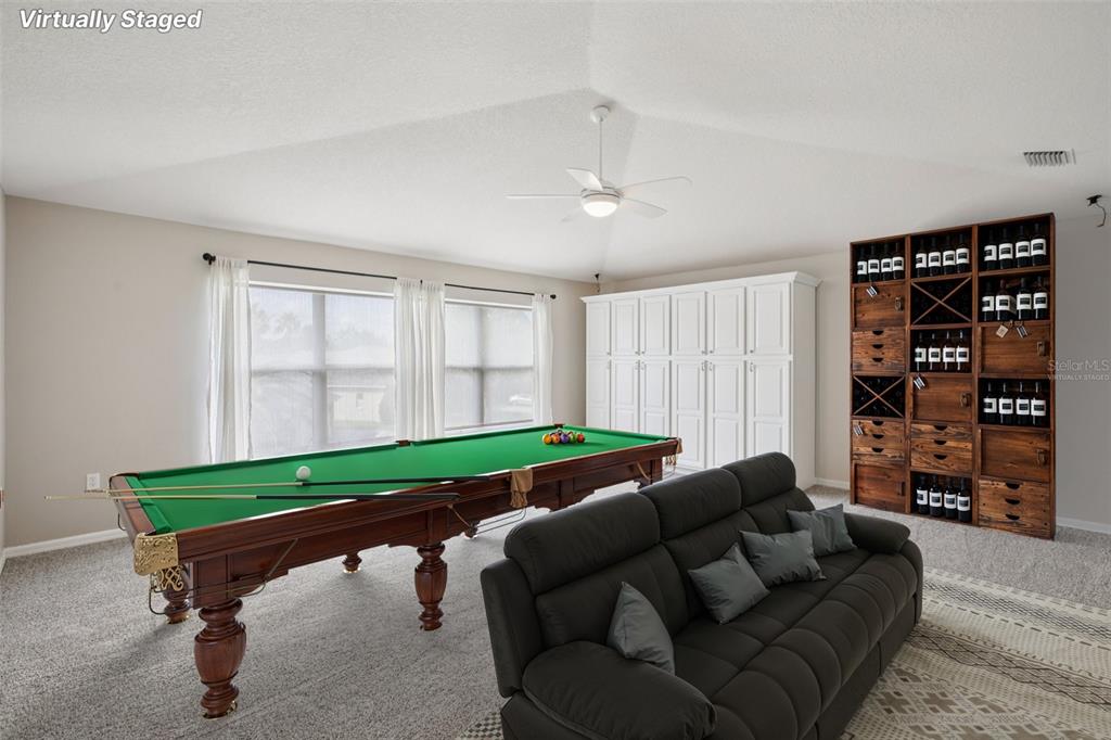 2903 Mossy Timber Trail Valrico, FL 33596 - Photo 25 of 39 a living room with furniture and a book shelf