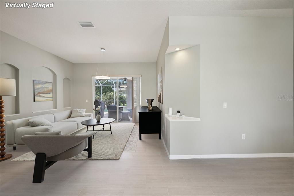 2903 Mossy Timber Trail Valrico, FL 33596 - Photo 3 of 39 a living room with furniture and a large window