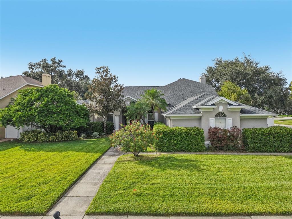 2903 Mossy Timber Trail Valrico, FL 33596 - Photo 33 of 39 a front view of a house with garden
