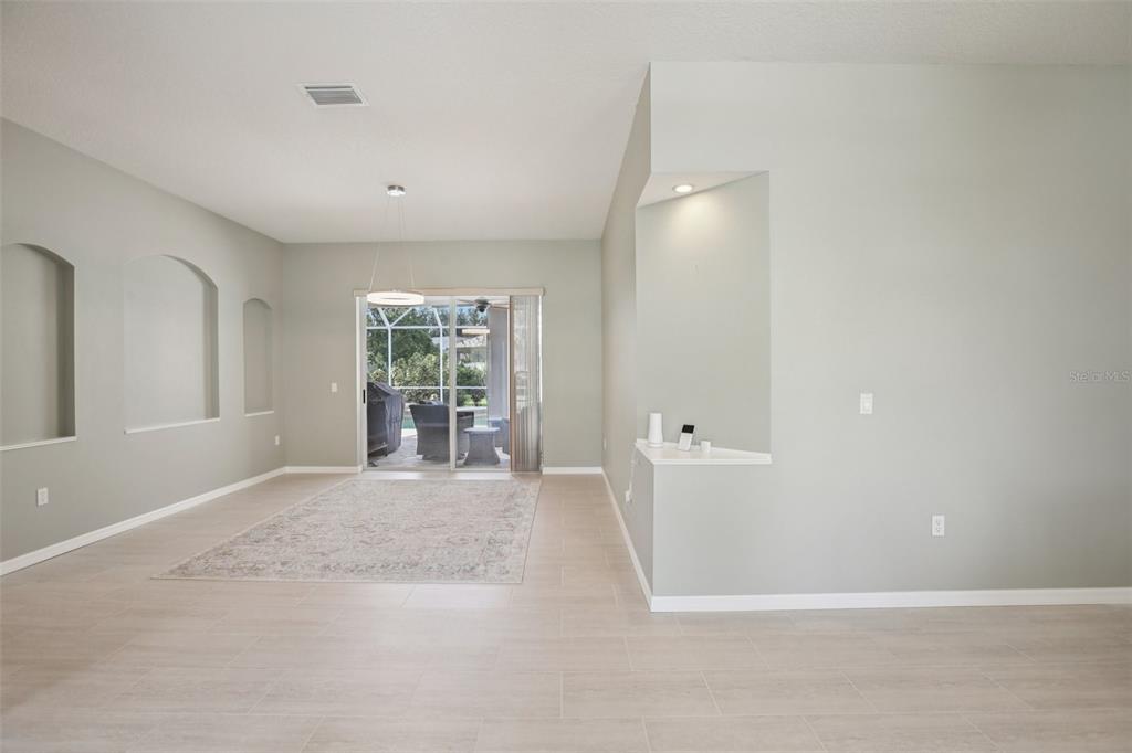 2903 Mossy Timber Trail Valrico, FL 33596 - Photo 4 of 39 a view of a big room with windows and chandelier