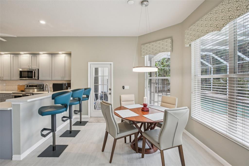 2903 Mossy Timber Trail Valrico, FL 33596 - Photo 9 of 39 a view of a dining room with furniture and window