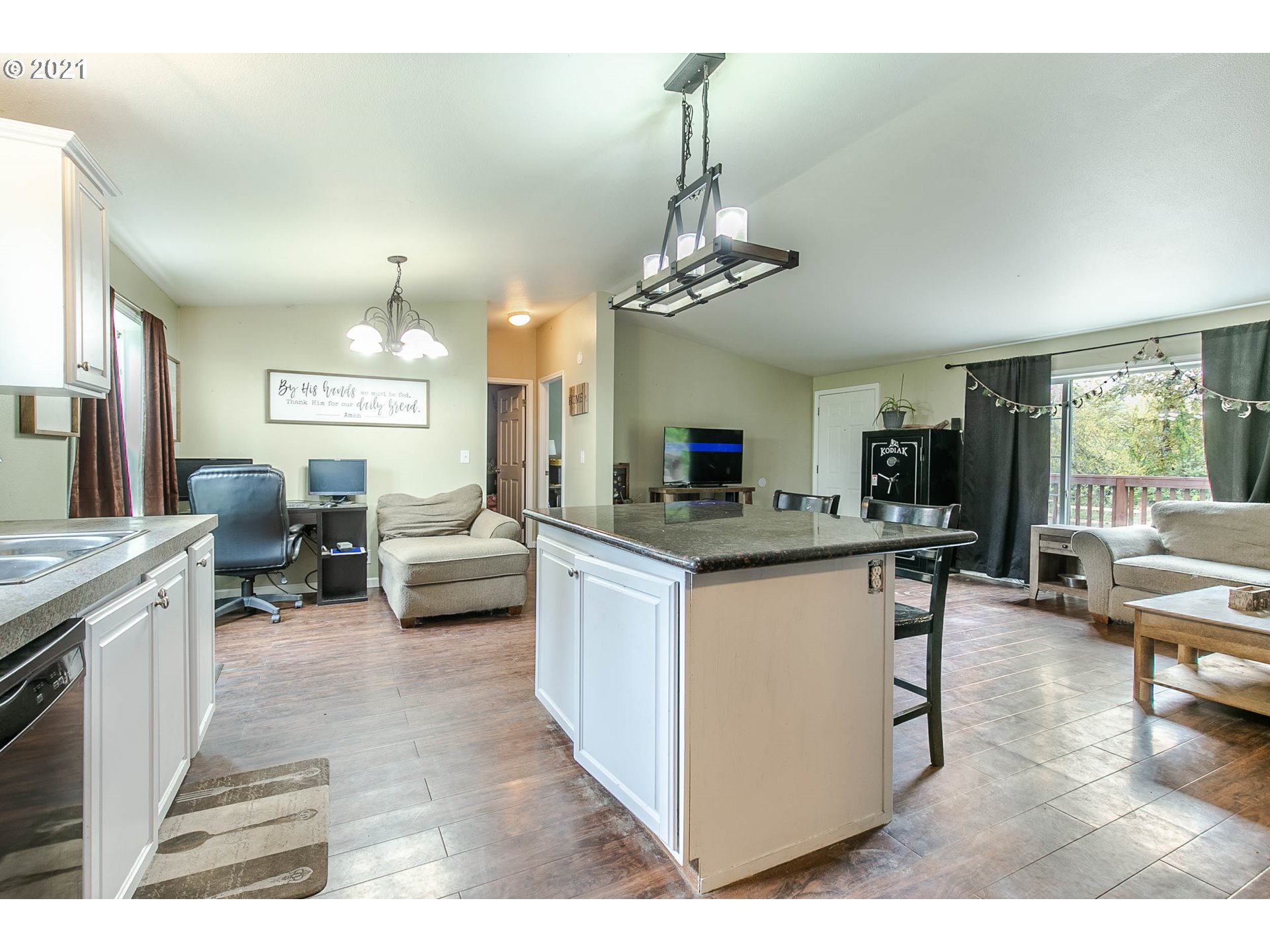 38075 Wheeler Road Dexter, OR 97431 - Photo 15 of 32 a view of living room kitchen with granite countertop stainless steel appliances refrigerator stove dining table and chairs