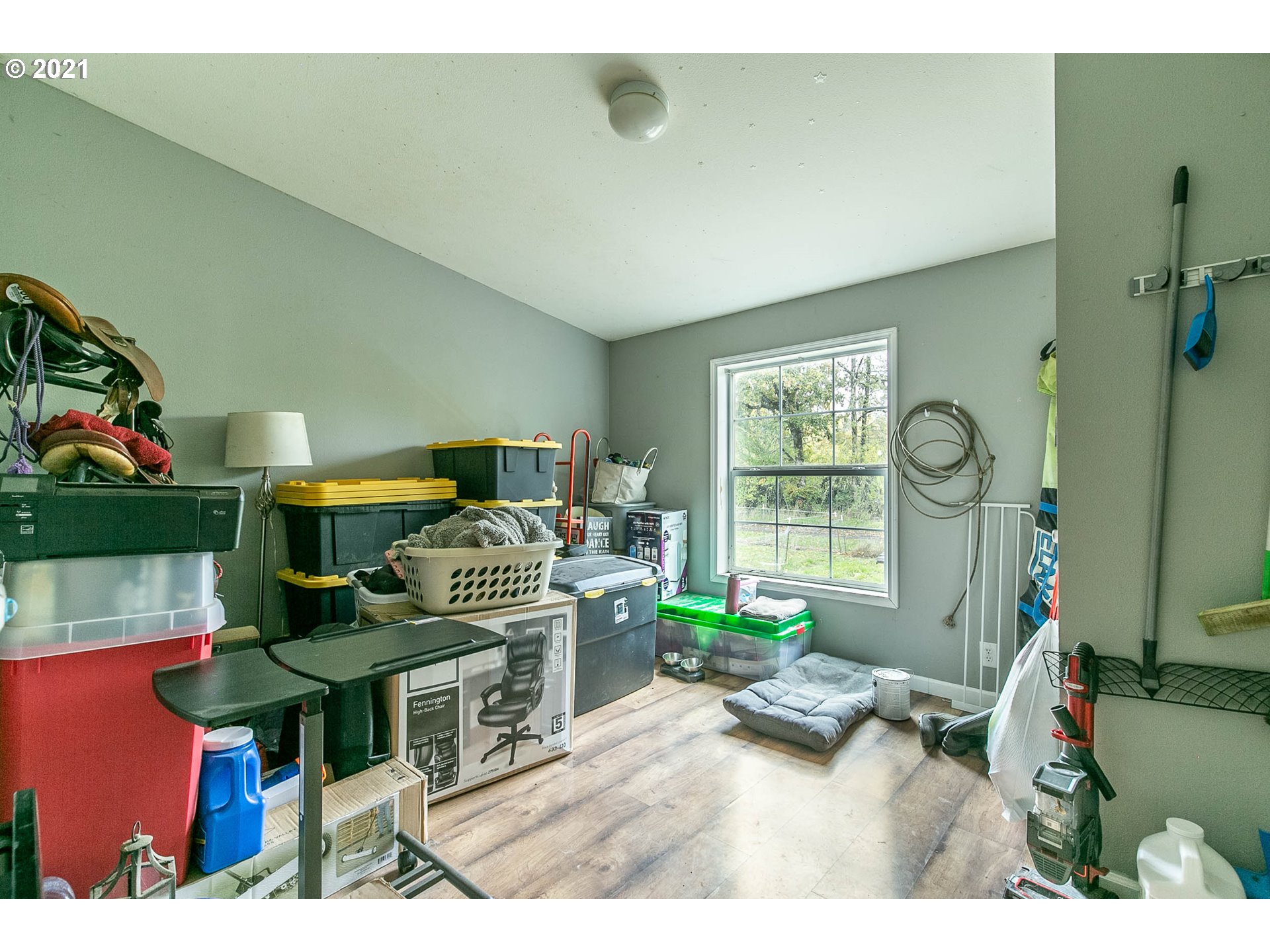 38075 Wheeler Road Dexter, OR 97431 - Photo 20 of 32 a living room with furniture a window and gym equipment