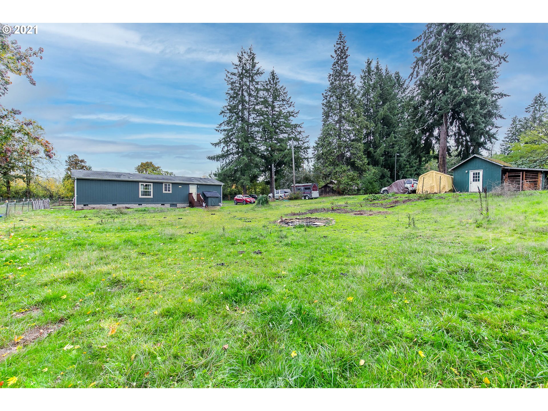 38075 Wheeler Road Dexter, OR 97431 - Photo 24 of 32 a backyard of a house with table and chairs
