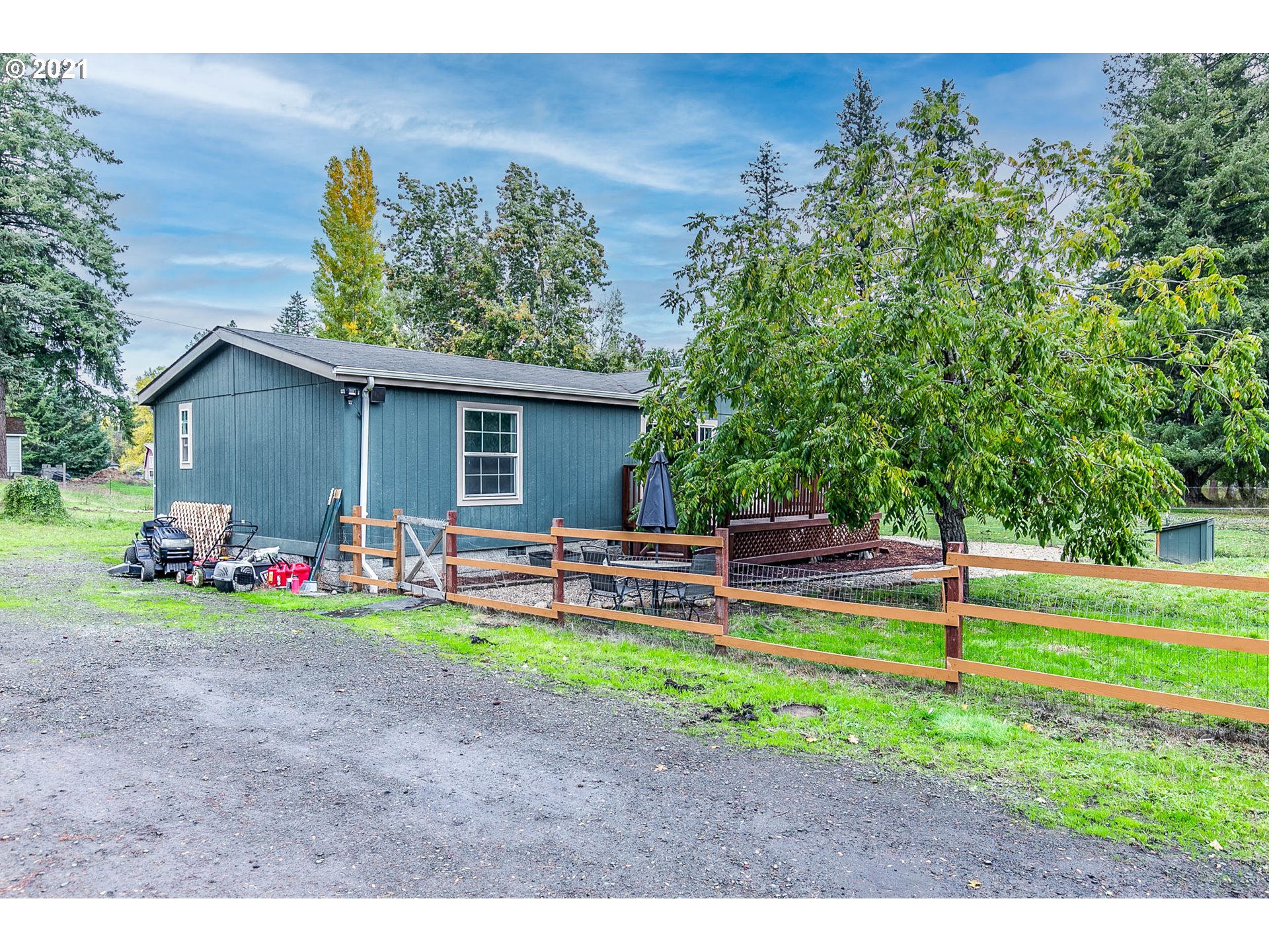 38075 Wheeler Road Dexter, OR 97431 - Photo 4 of 32 a view of a house with backyard and sitting area