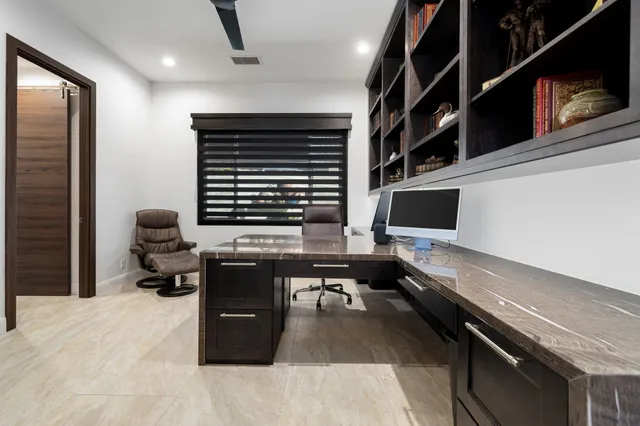 a kitchen with stainless steel appliances a sink stove and cabinets