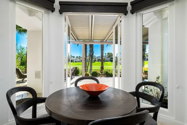 a kitchen with a refrigerator a sink and wooden cabinets