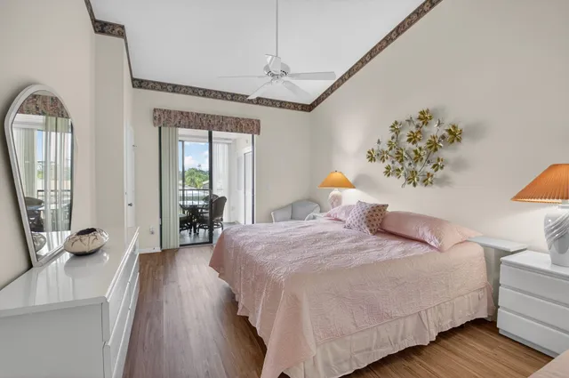 a bedroom with a large bed and a couch