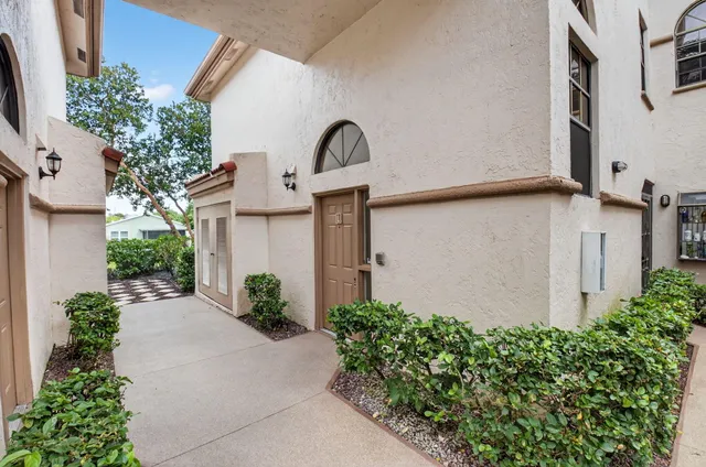 a lobby with furniture and floor to ceiling window