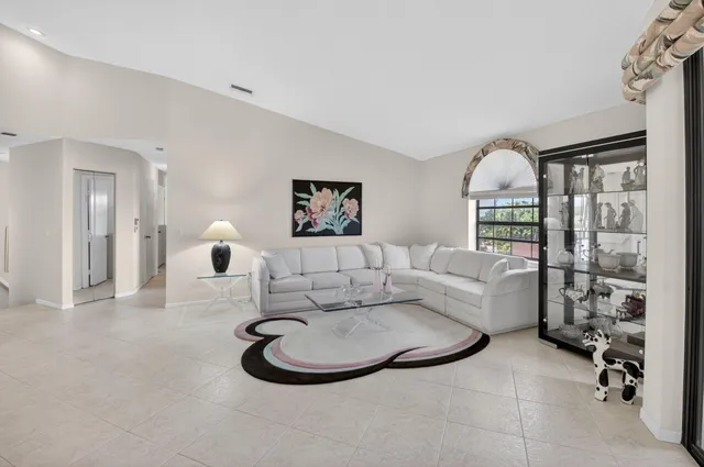 a dining room with furniture and a chandelier