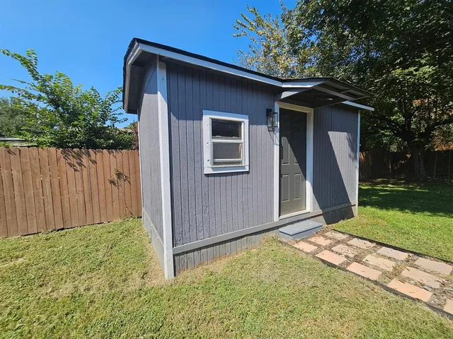a view of a backyard of the house