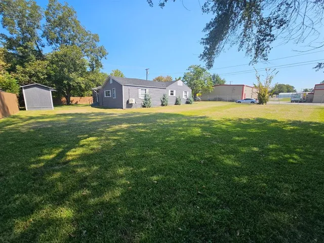 a view of a house with a big yard