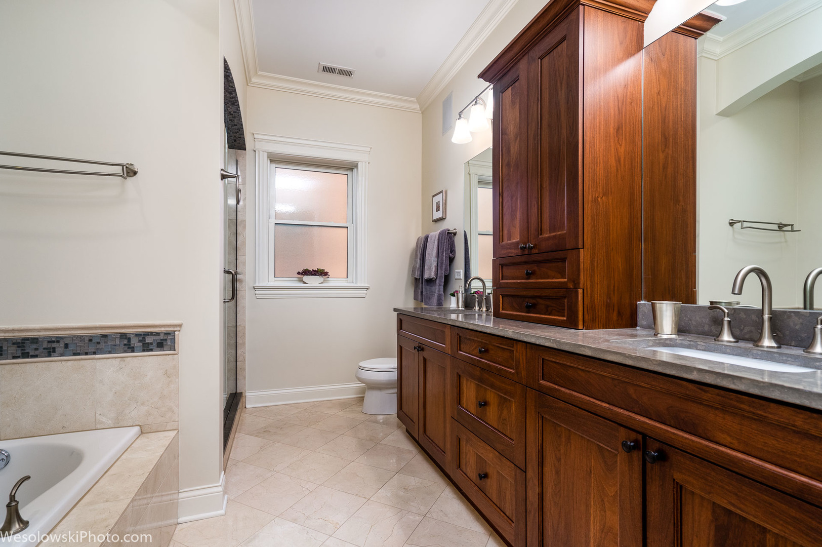 106 South Sangamon Street, Unit 2N Chicago, IL 60607 - Photo 15 of 27 a spacious bathroom with a double vanity sink and a mirror