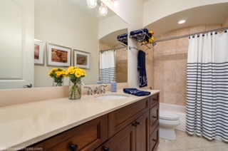 106 South Sangamon Street, Unit 2N Chicago, IL 60607 - Photo 20 of 27 a bathroom with a sink a toilet and mirror