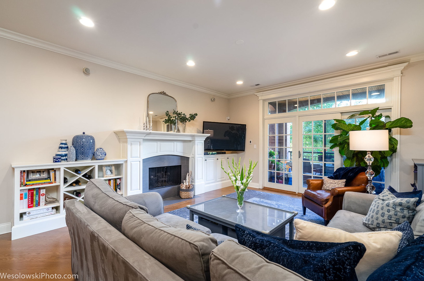 106 South Sangamon Street, Unit 2N Chicago, IL 60607 - Photo 3 of 27 a living room with furniture a fireplace and a floor to ceiling window