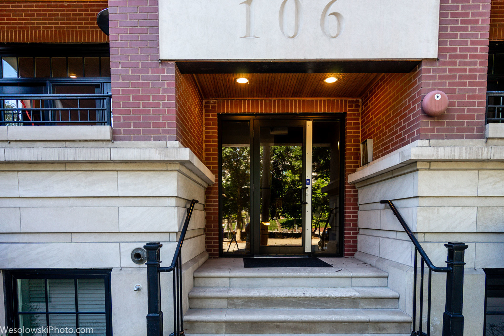 106 South Sangamon Street, Unit 2N Chicago, IL 60607 - Photo 24 of 27 a front view of a building with glass windows and door