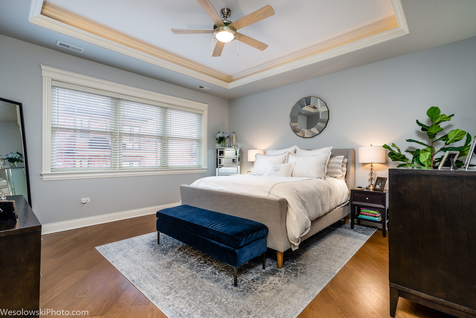 106 South Sangamon Street, Unit 2N Chicago, IL 60607 - Photo 10 of 27 a bedroom with a bed and a potted plant on a dresser