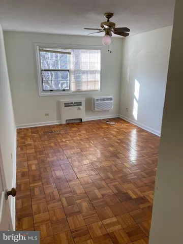 a view of an empty room with a window