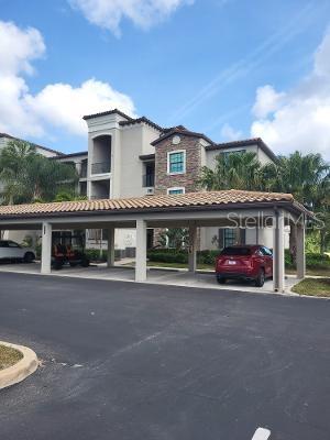 17108 Vardon Terrace, Unit 208 Lakewood Ranch, FL 34211 - Photo 13 of 14 a view of a car park in front of house