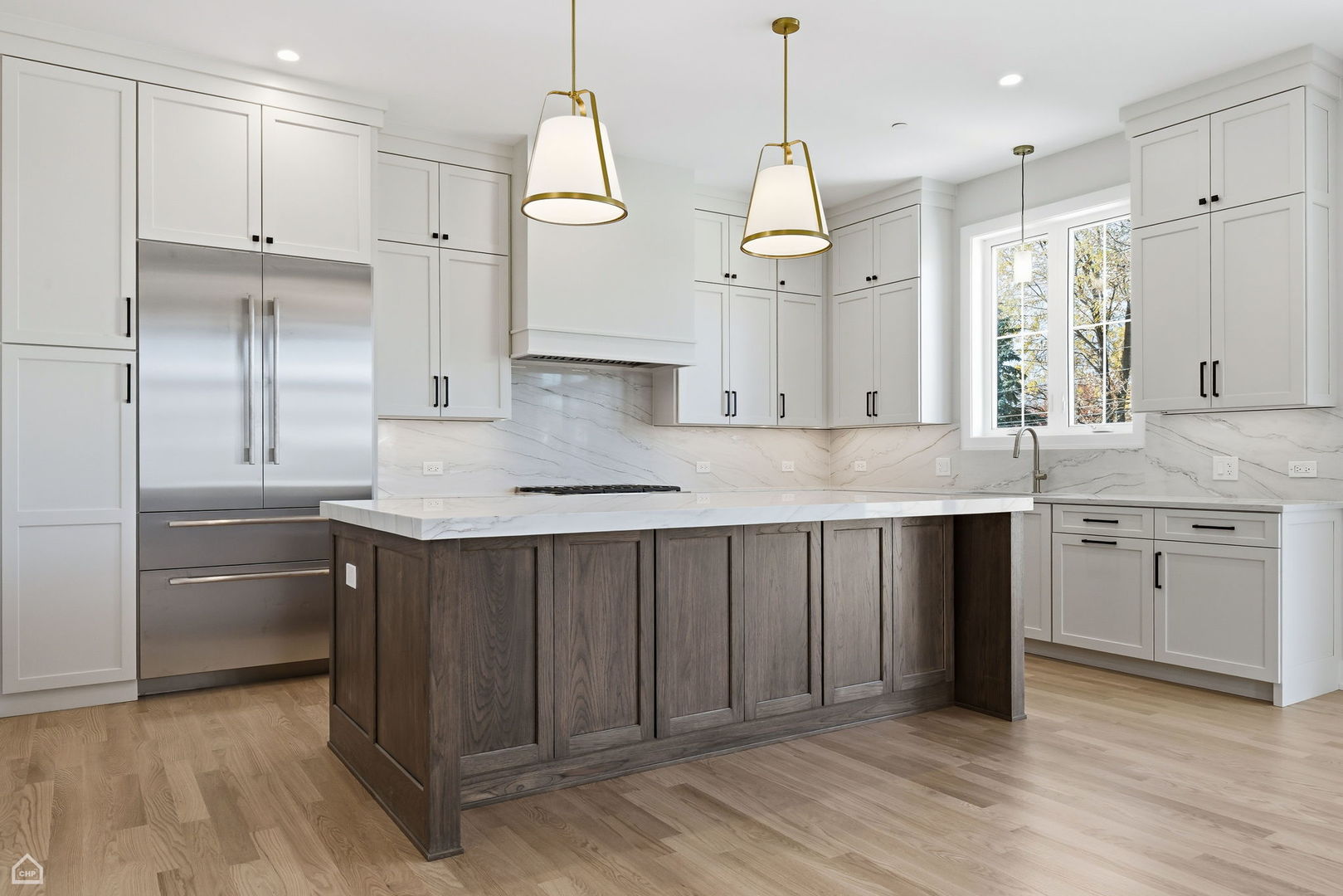 1220 Courtland Avenue Park Ridge, IL 60068 - Photo 11 of 32 a kitchen with kitchen island granite countertop a sink cabinets and stainless steel appliances