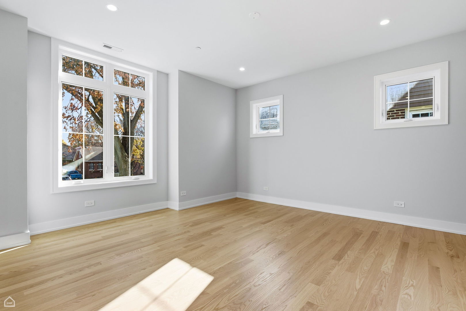 1220 Courtland Avenue Park Ridge, IL 60068 - Photo 22 of 32 a view of an empty room with wooden floor and a window