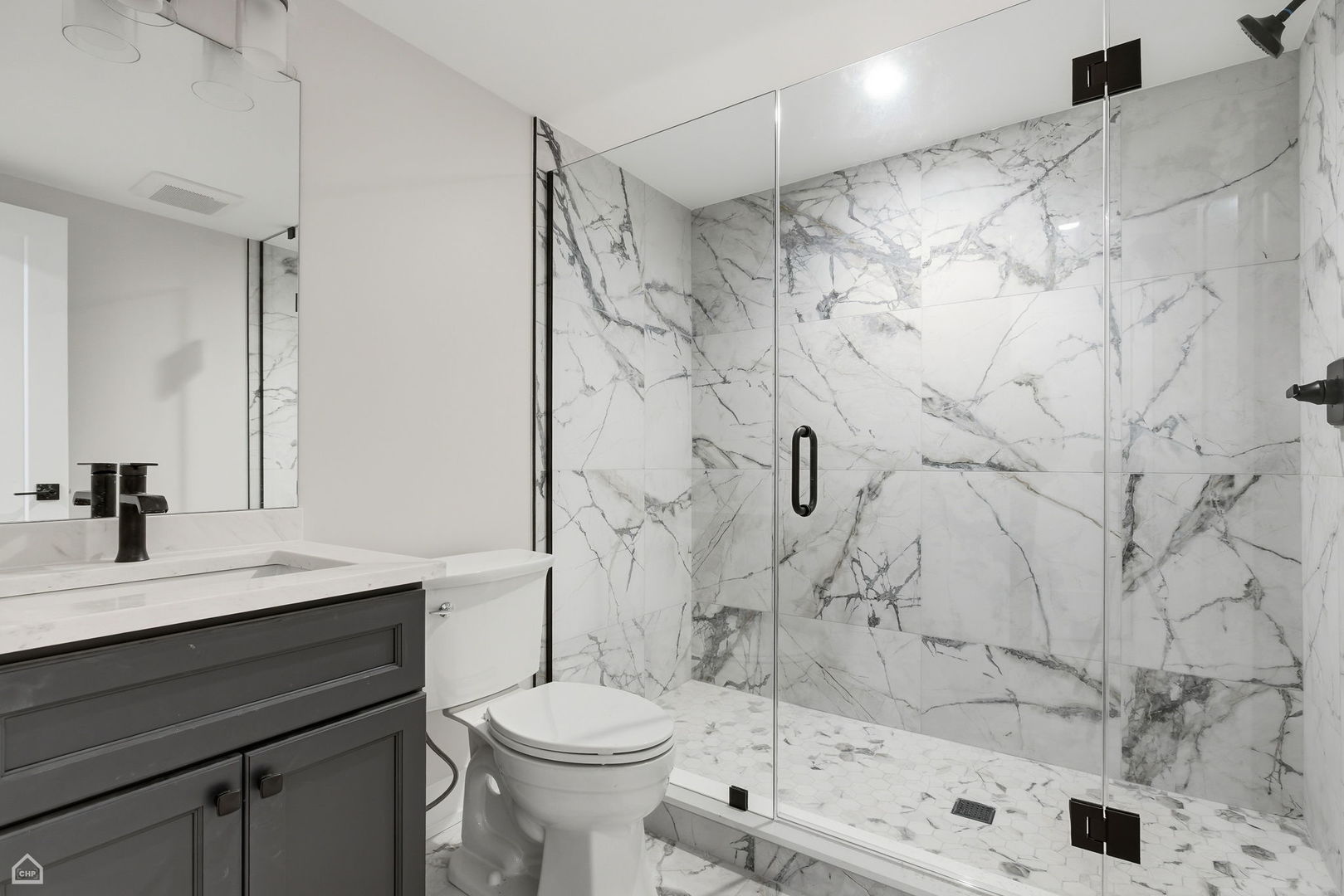 1220 Courtland Avenue Park Ridge, IL 60068 - Photo 28 of 32 a bathroom with a sink toilet a mirror and shower