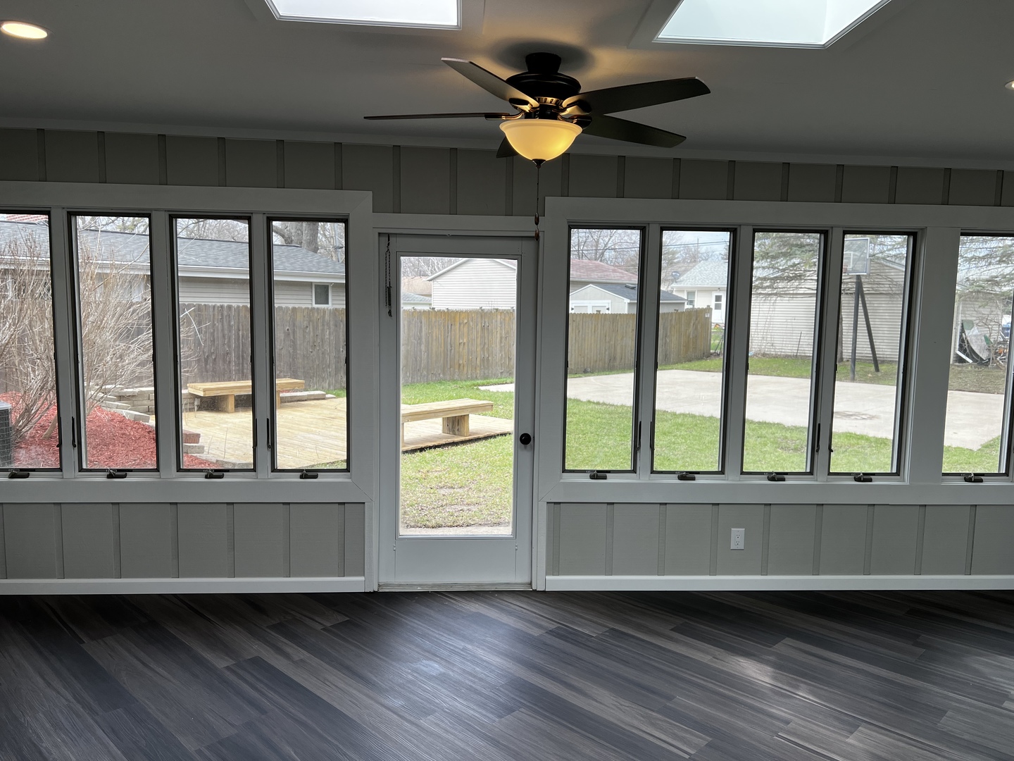 121 Wendell Place DeKalb, IL 60115 - Photo 17 of 35 a view of an empty room with a window and wooden floor