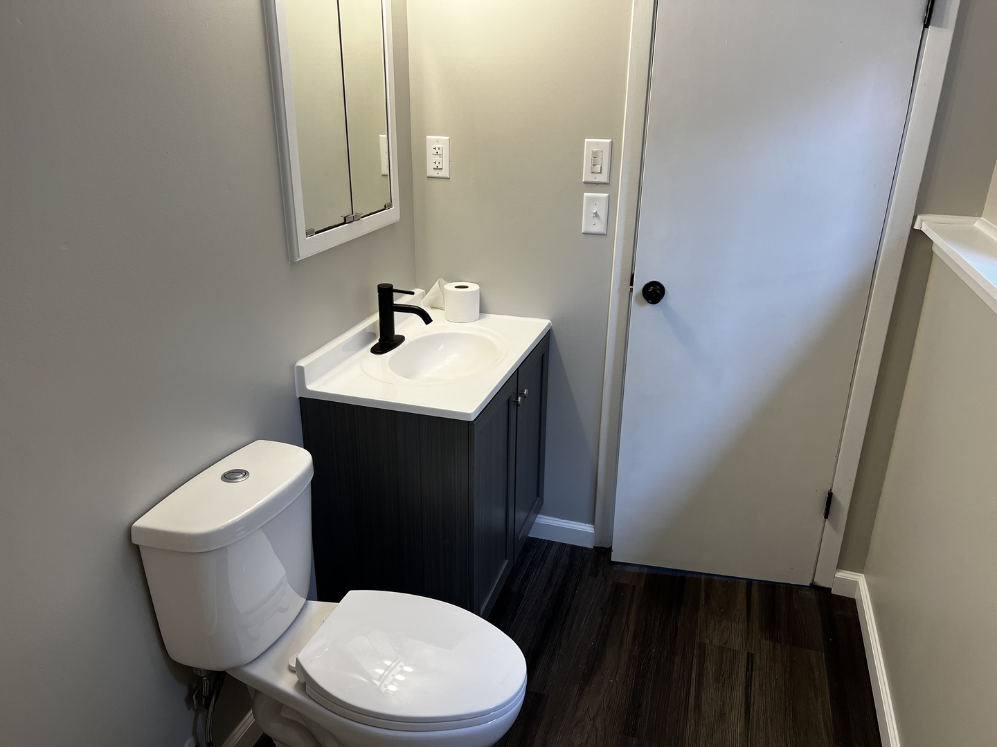 121 Wendell Place DeKalb, IL 60115 - Photo 23 of 35 a white toilet sitting next to a bathroom sink