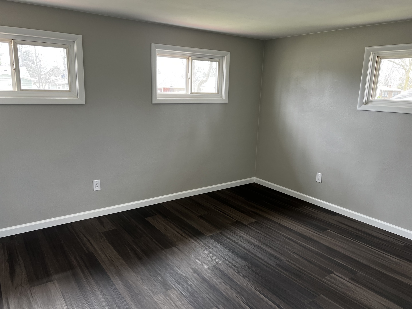 121 Wendell Place DeKalb, IL 60115 - Photo 27 of 35 a view of an empty room with wooden floor and a window