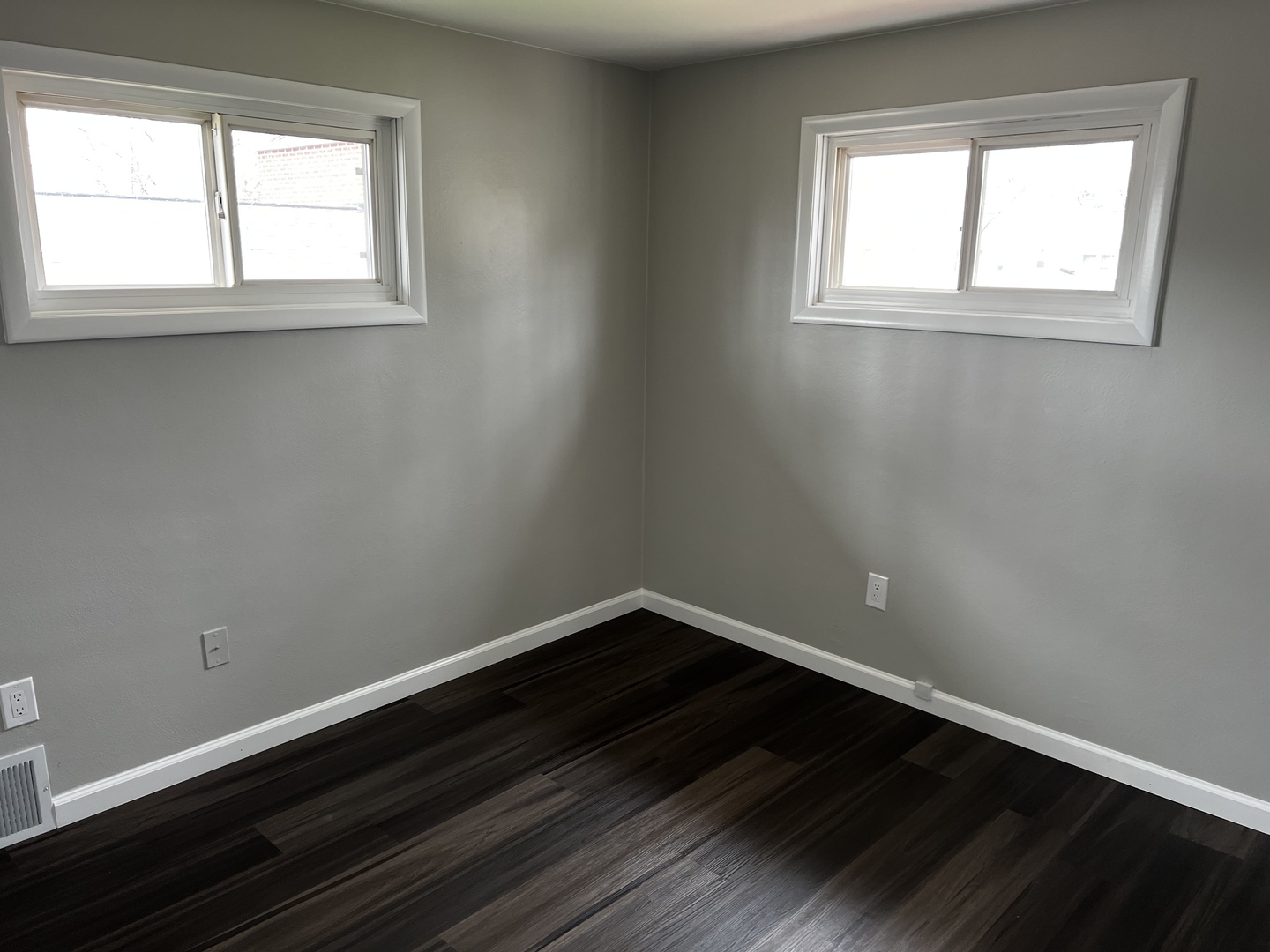 121 Wendell Place DeKalb, IL 60115 - Photo 31 of 35 an empty room with wooden floor and windows