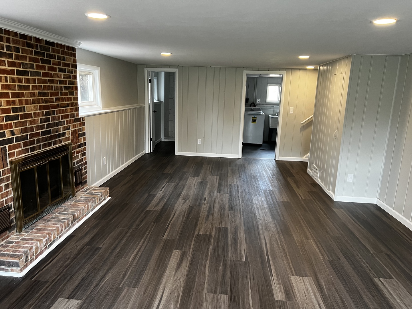 121 Wendell Place DeKalb, IL 60115 - Photo 33 of 35 a view of an empty room with wooden floor and a kitchen
