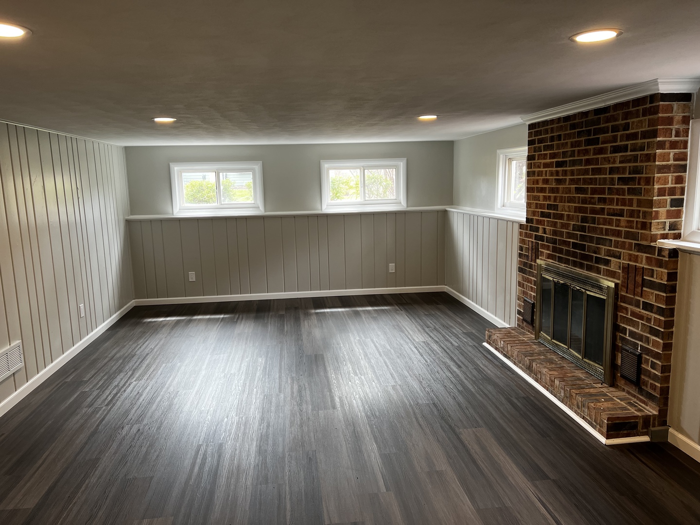 121 Wendell Place DeKalb, IL 60115 - Photo 34 of 35 a view of empty room with wooden floor and fireplace