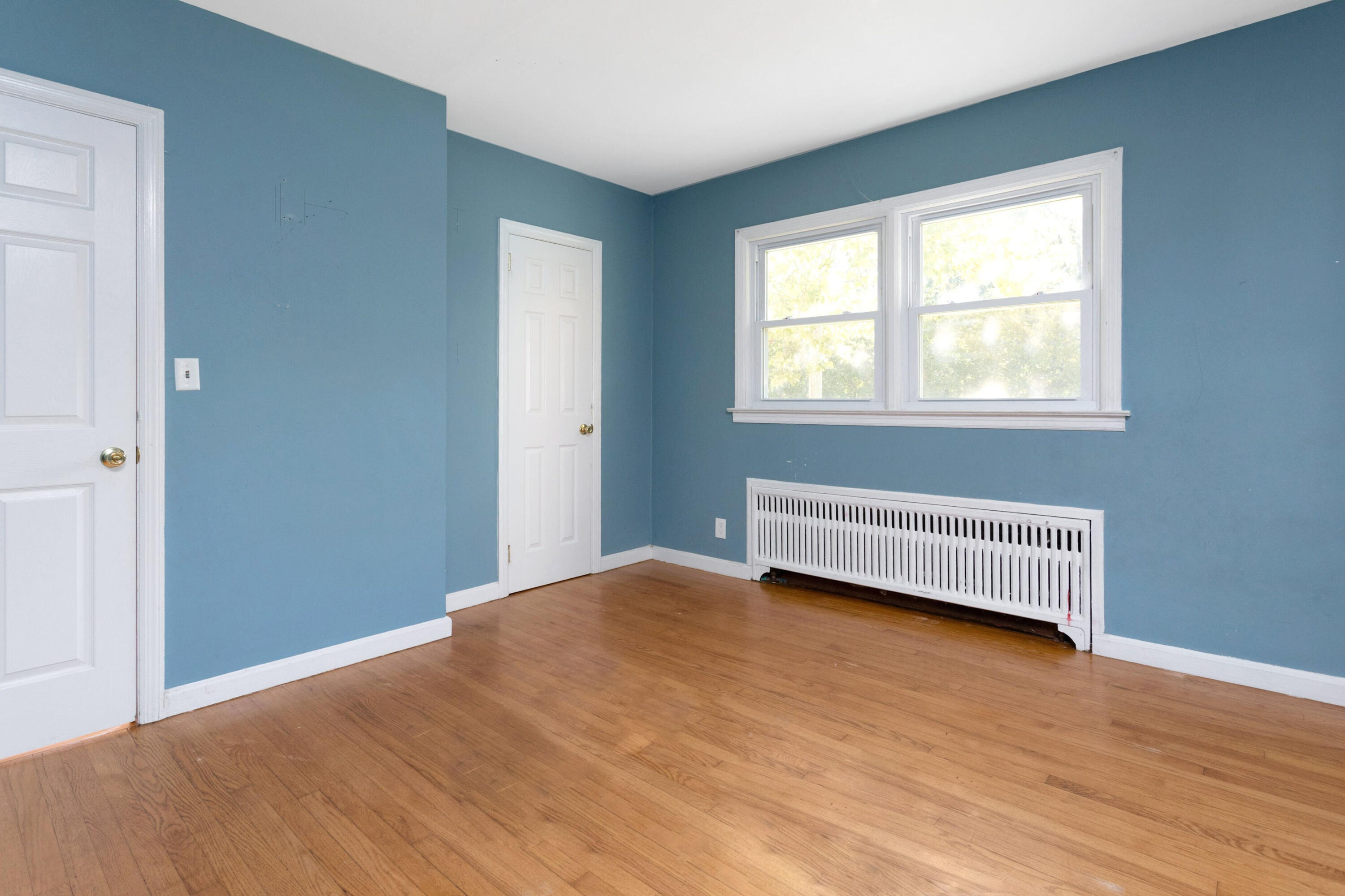18 Ledge Road Darien, CT 06820 - Photo 12 of 16 a view of an empty room with wooden floor and a window