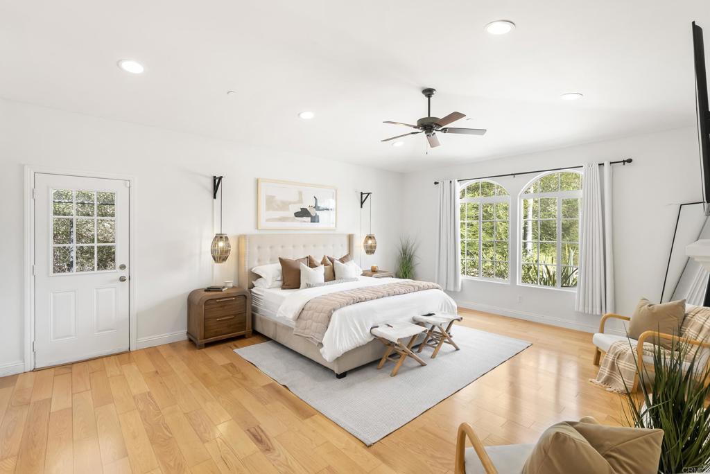 17412 La Brisa Rancho Santa Fe, CA 92067 - Photo 17 of 37 a spacious bedroom with a bed couch and a large window
