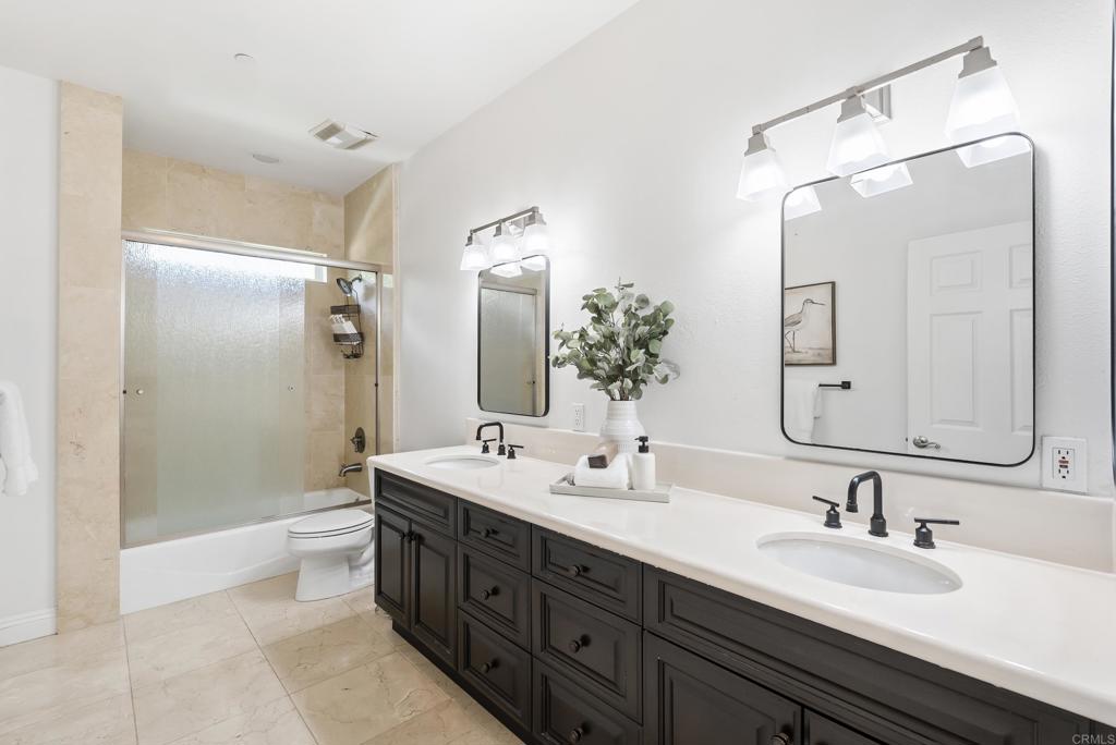17412 La Brisa Rancho Santa Fe, CA 92067 - Photo 23 of 37 a bathroom with a double vanity sink mirror double and shower
