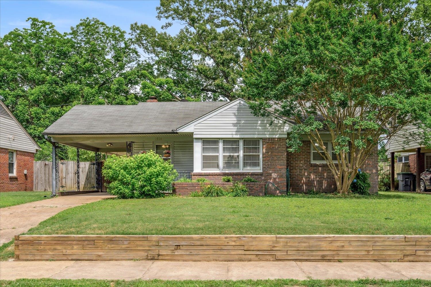 1524 Hopewell Road Memphis, TN 38117 - Photo 1 of 34 front view of a house with a yard