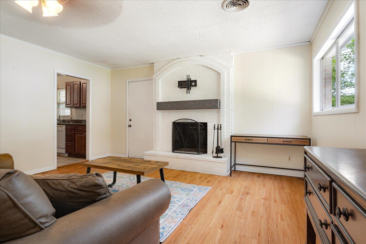 1524 Hopewell Road Memphis, TN 38117 - Photo 15 of 34 a living room with furniture and a fireplace