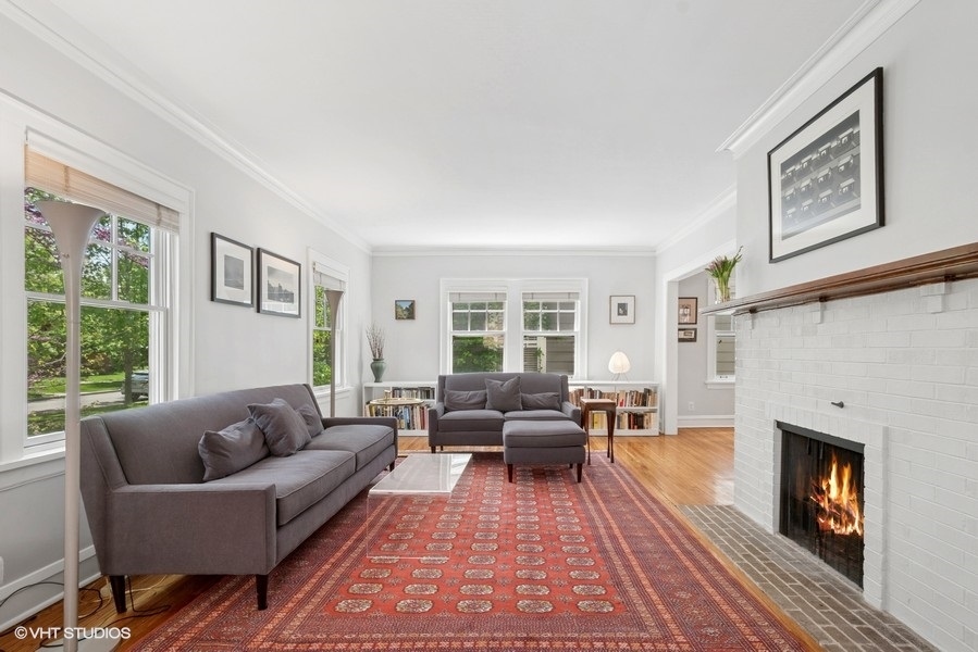 2206 Forestview Road Evanston, IL 60201 - Photo 2 of 32 a living room with furniture large window and a fireplace