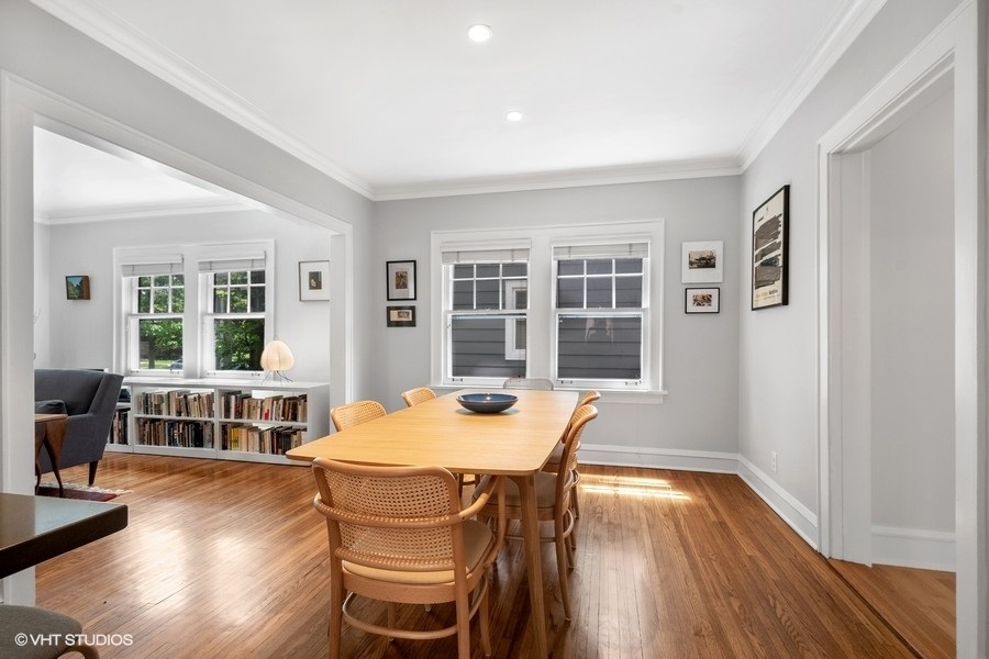 2206 Forestview Road Evanston, IL 60201 - Photo 9 of 32 a dining room with wooden floor and large windows