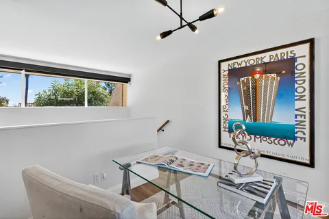 a workspace with furniture and window