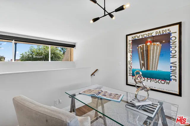 a workspace with furniture and window