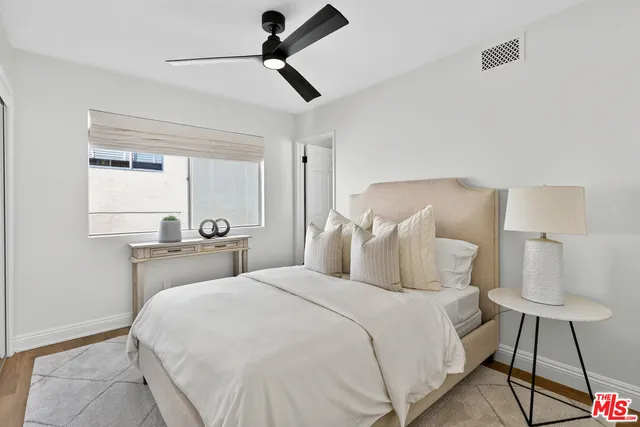 a bedroom with a bed and a walk in closet