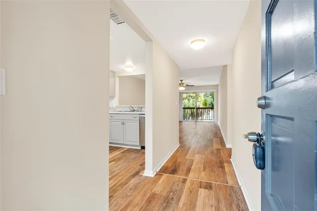 a kitchen with granite countertop a stove and a refrigerator