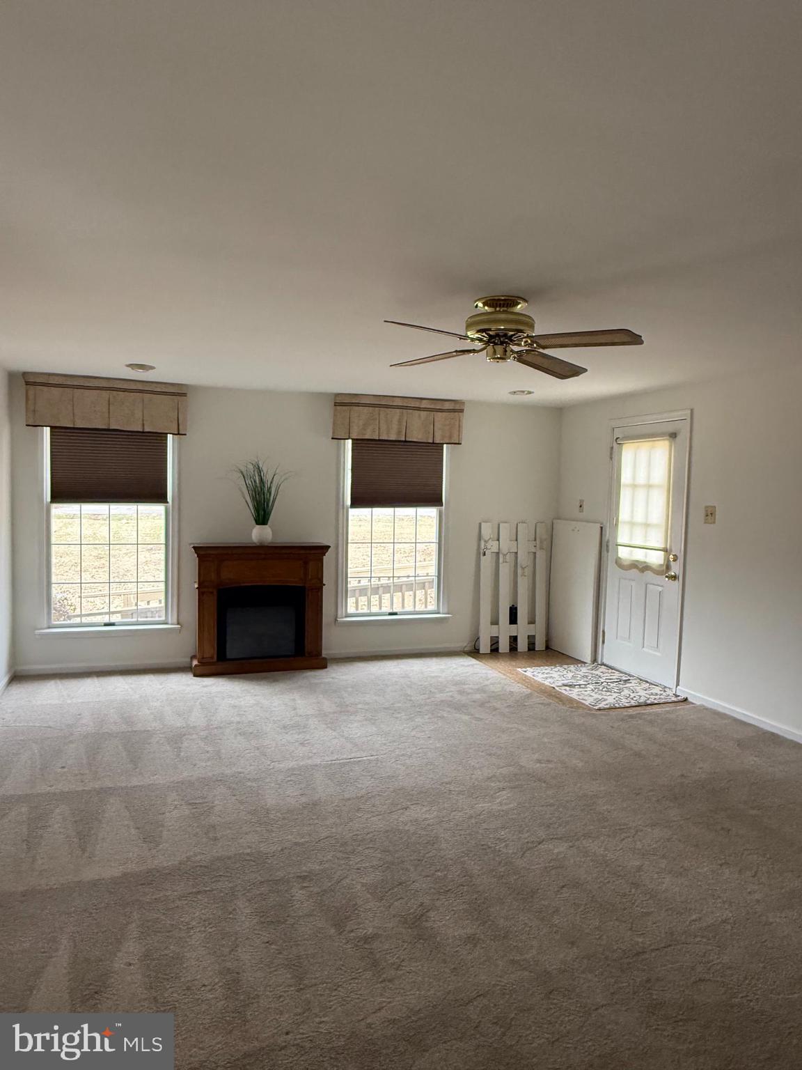 6608 Horseshoe Road Clinton, MD 20735 - Photo 14 of 20 a view of an empty room with a window and fireplace