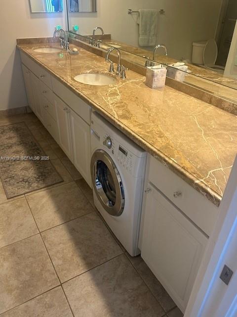 350 South Beach Road, Unit 204 Tequesta, FL 33469 - Photo 15 of 36 a bathroom with a granite countertop sink and a mirror
